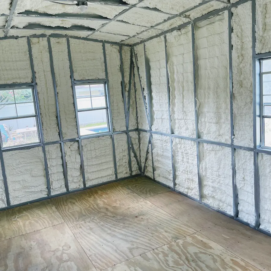 Closed-cell spray foam insulation applied to wall cavities in a residential project in Orchards